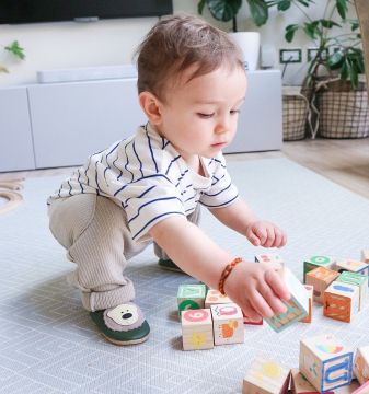 Baby boy wearing Dotty Fish bear shoes
