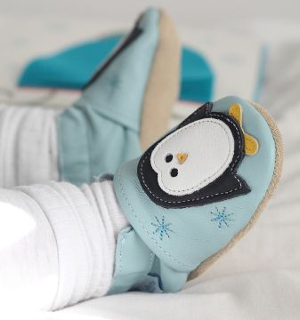 Baby wearing Dotty Fish penguin shoes
