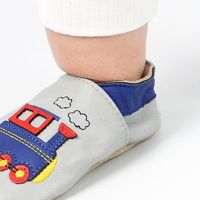 Dotty Fish soft leather baby shoes worn by small boy