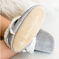 Toddler wearing soft grey suede slippers