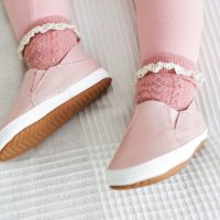 Toddler wearing pink slip on shoes by Dotty Fish