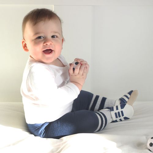 Baby boy wearing Navy Trainers by Dotty Fish 