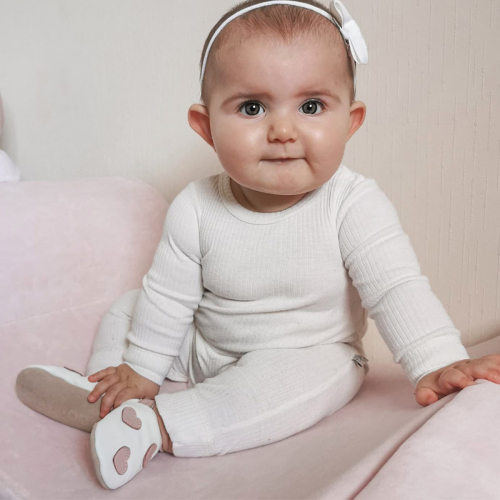 baby girl wearing Queen of Hearts white and pink baby shoes from Dotty Fish 