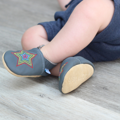 Baby wearing Dotty Fish Grey Rainbow Star soft leather baby shoes