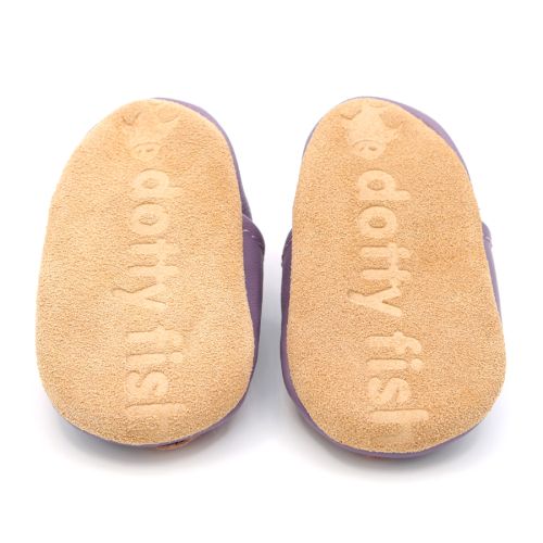 Soft suede non-slip sole of Dotty Fish infant booties imprinted with Dotty Fish name and logo.