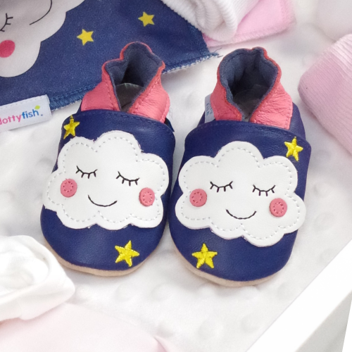 Navy leather cloud shoes, in drawer with baby clothing.