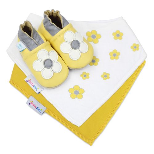 Dotty Fish baby gift set including yellow leather shoes with white flower, a yellow cotton bib and a yellow flower cotton bib.