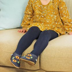 Little girls wearing Honey Blossom navy and yellow soft leather baby shoes from Dotty Fish 
