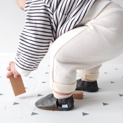 Baby walking while wearing Dotty Fish grey leather baby shoes 