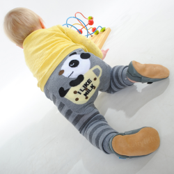 Baby crawling while wearing grey panda leggings from Dotty Fish 