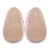 Non-slip soft suede soles of Dotty Fish pre-walker shoes imprinted with Dotty Fish name and logo.