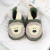 Leather bear shoes, in drawer with baby blankets.