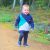 Little boy wearing Dotty Fish navy blue leather pre-walker rubber sole slip-on shoes.