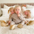 Three young children wearing Dotty Fish tan slippers.