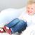 Small boy sitting wearing red Dotty Fish monkey shoes.