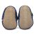 Soft suede soles of baby booties, imprinted with Dotty Fish logo.