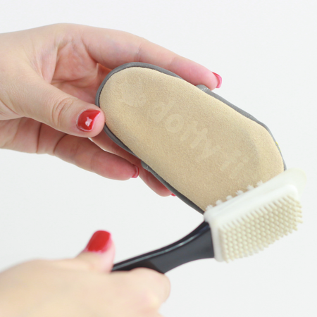 Signature Dotty Fish suede sole being cleaned with suede brush