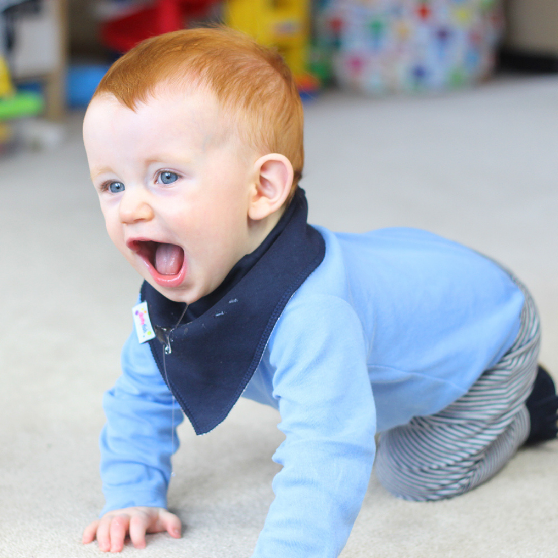 Crawling baby wearing Dotty Fish baby shoes