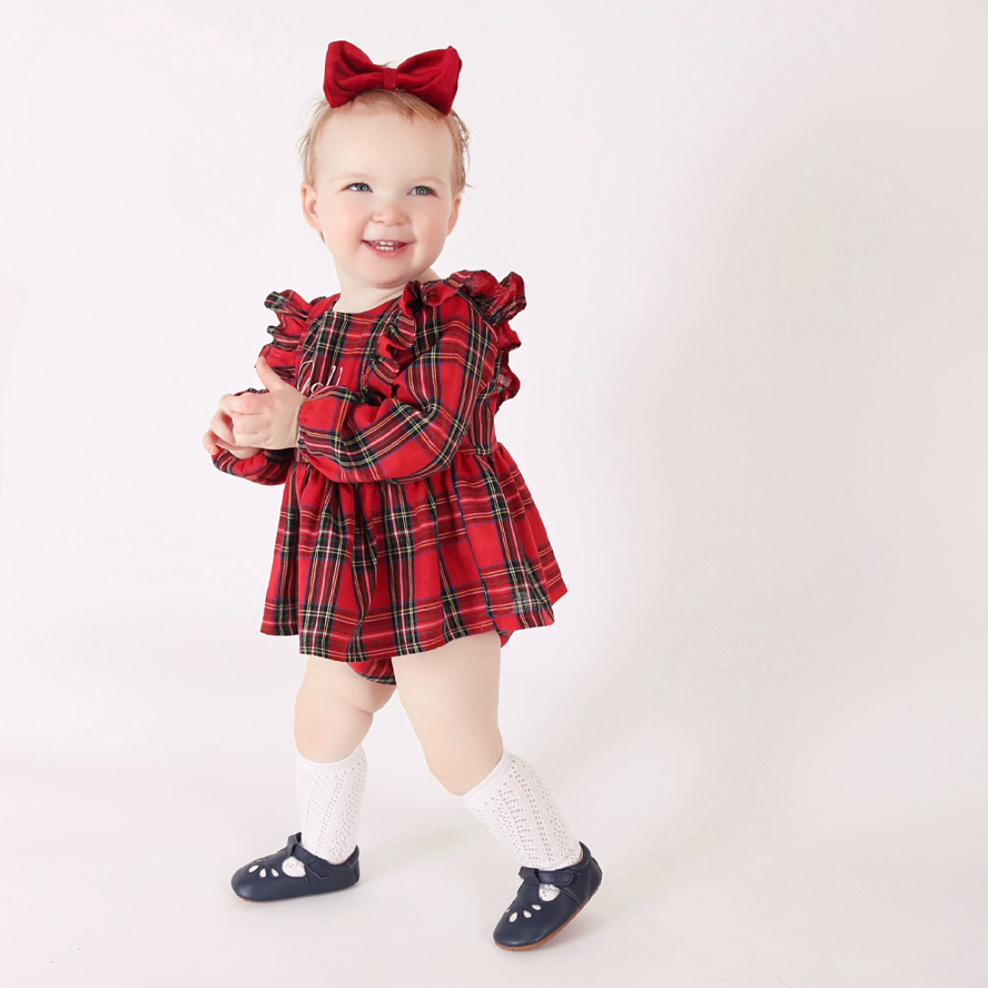 Toddler wearing rubber soled first walking shoes from Dotty Fish