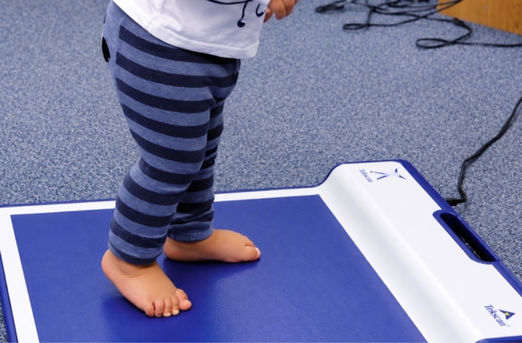 Child walking during Dotty Fish soft sole shoe testing.