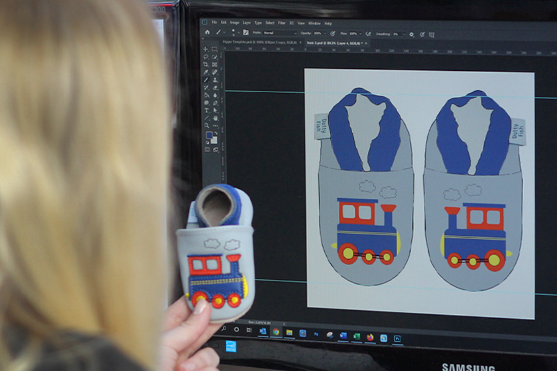 Designs for grey leather train shoe on computer screen, with finished product.