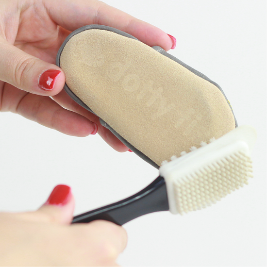 Dotty Fish soft suede soles being cleaned using suede brush.
